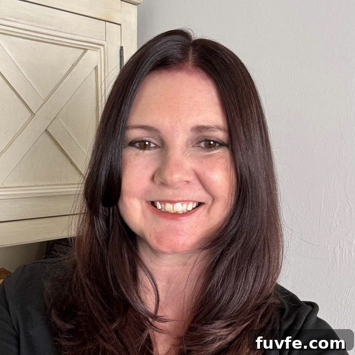 Savory Sage Stuffing Recipe for Thanksgiving and Roast Dinners 10 Photo of Kimberly Vargo in front of a bookcase.