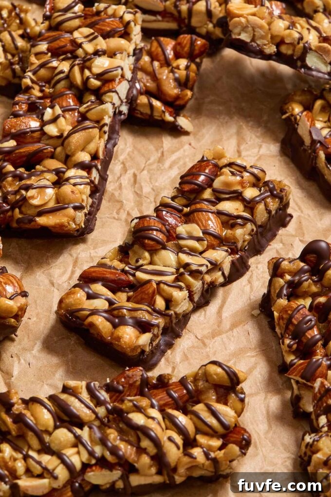 Nut bars drizzled with dark chocolate.