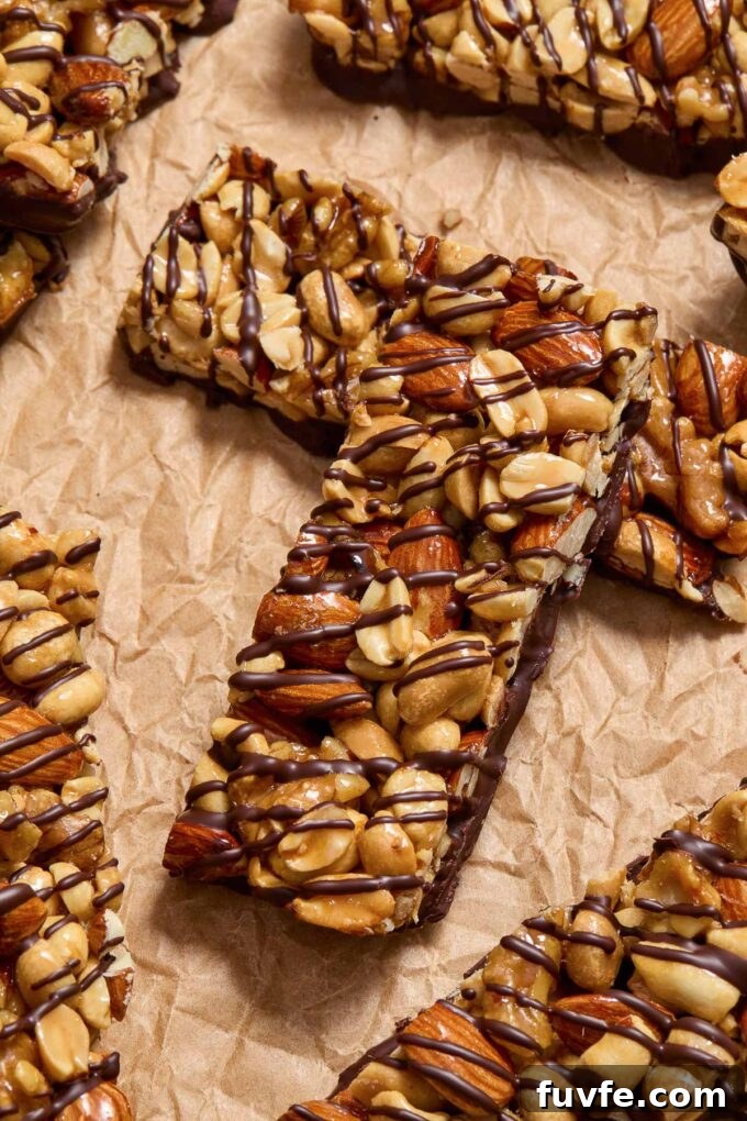 Kind nut bars laying on parchment paper.