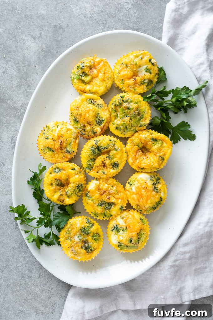 Platter of crustless mini quiche with parsley and linen alongside