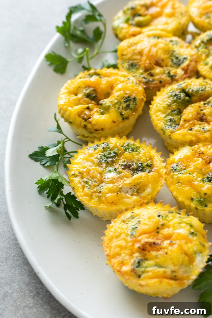 Mini crustless broccoli quiche on a white serving platter
