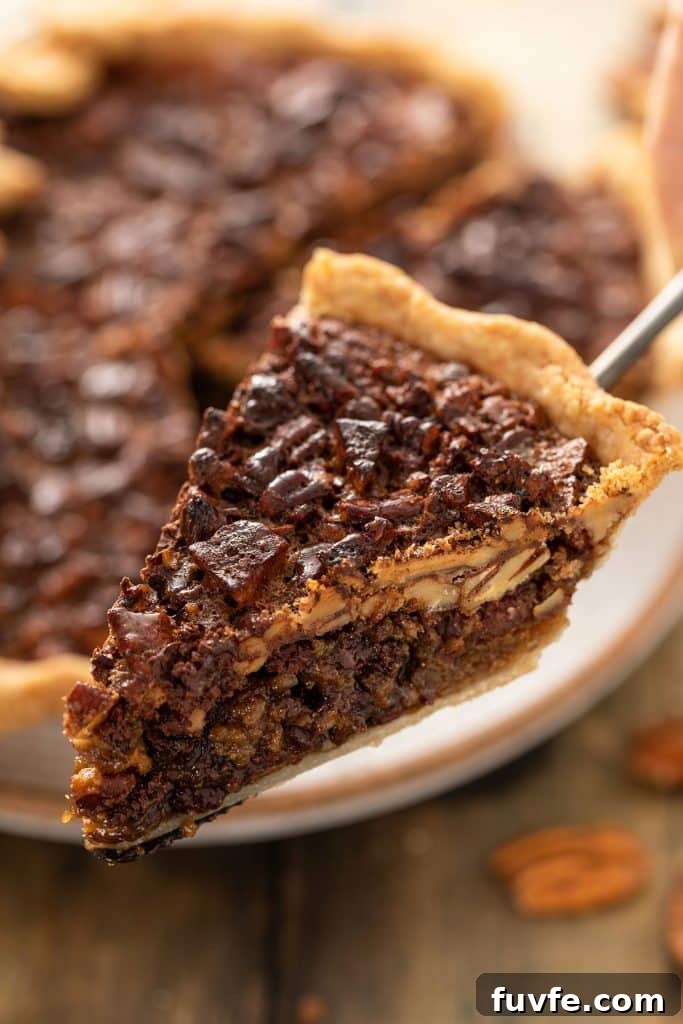 Close up view of a slice of Chocolate Pecan Pie 