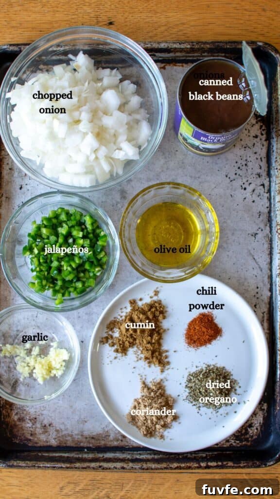 Quick Canned Black Beans Recipe for Flavorful Weeknight Meals 4 All the ingredients needed to make canned black beans including a can of black beans, onions, jalapeños, olive oil, and more.