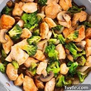 chicken and broccoli stir fry in a skillet