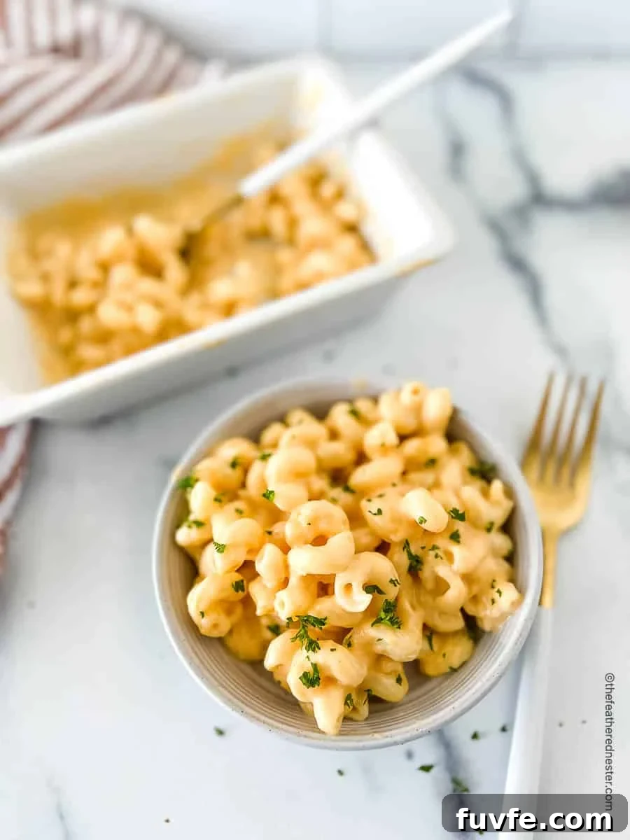 Macaroni with Velveeta cheese sauce in a bowl.
