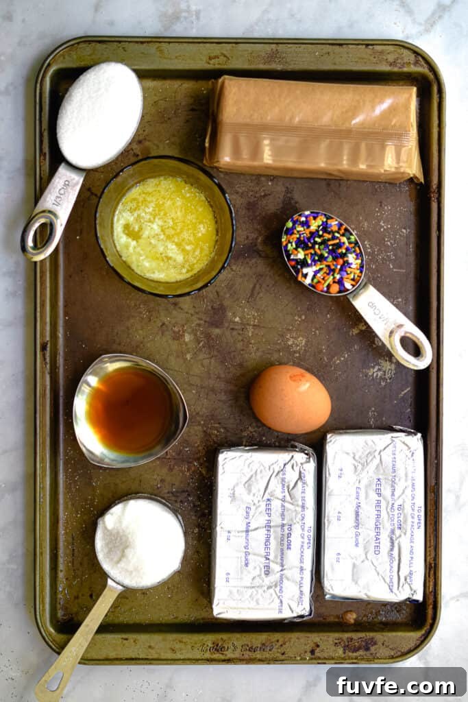 An overhead shot of the Halloween Funfetti Cheesecake Bar ingredients