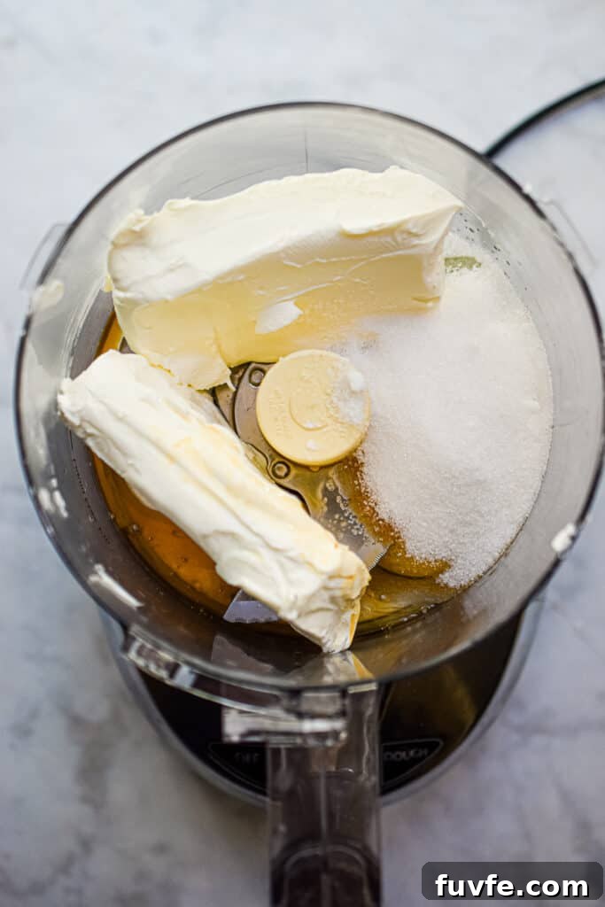 The ingredients for the filling are added to the bowl of a food processor
