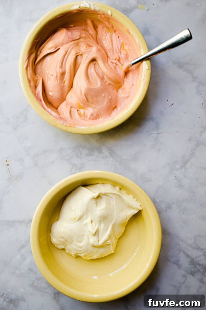 The cheesecake mixture is divided in half and half is colored orange