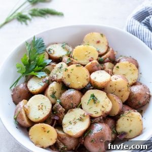 Authentic German Potato Salad Recipe 9 German potato salad in a white bowl