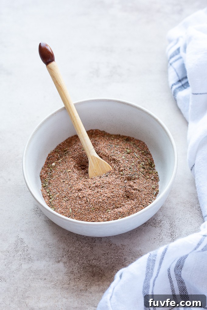 Blackened seasoning in a bowl with a linen alongside