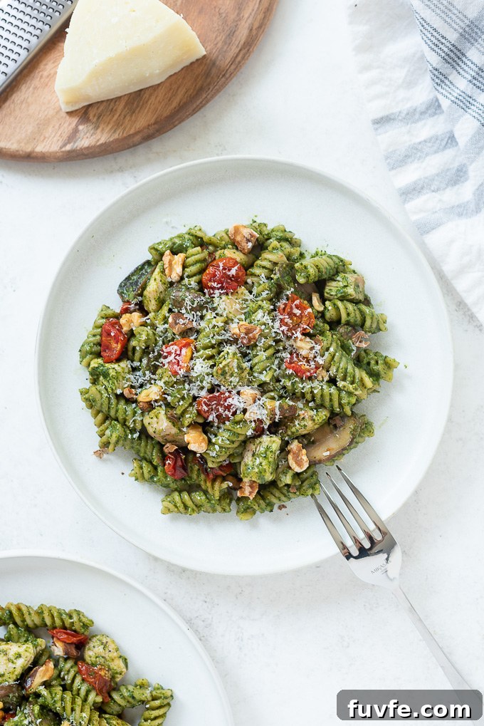 One pot chicken pesto pasta on a white plate