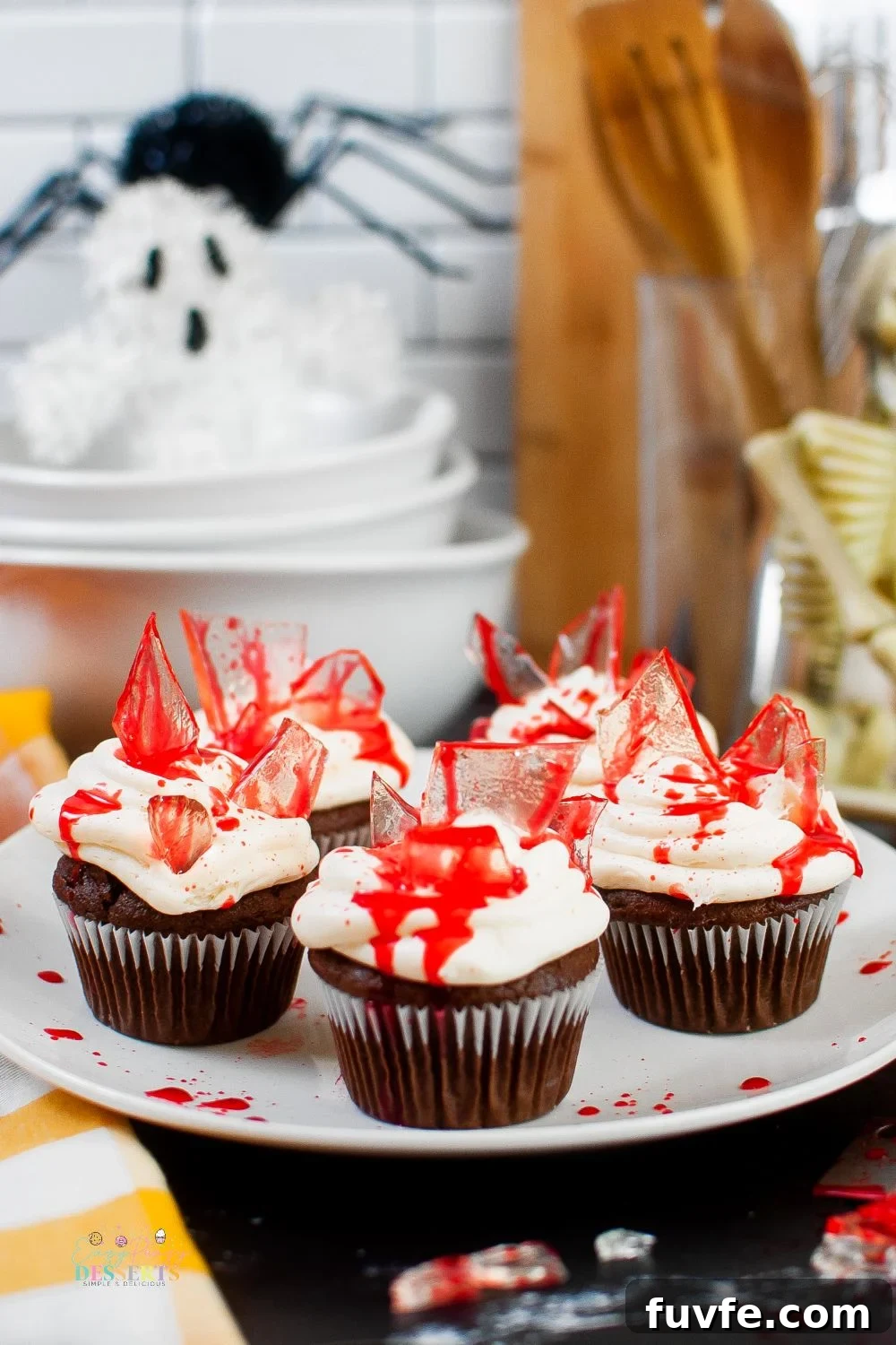 Close up image of bloody Halloween cupcakes on a serving plate