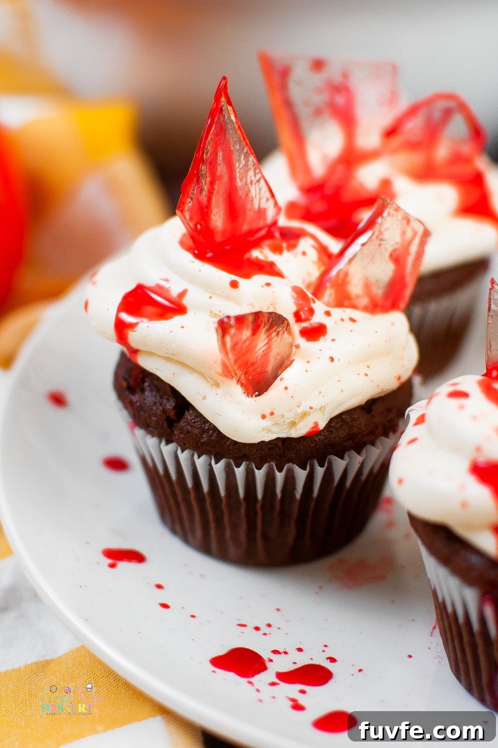 Close up image of bloody cupcakes with sugar glass shards and fake blood