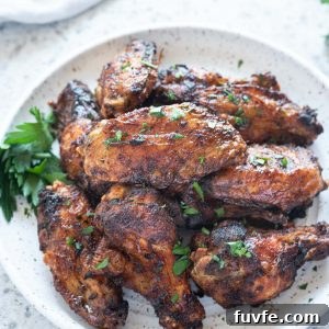 Air fryer chicken wings piled on a plate