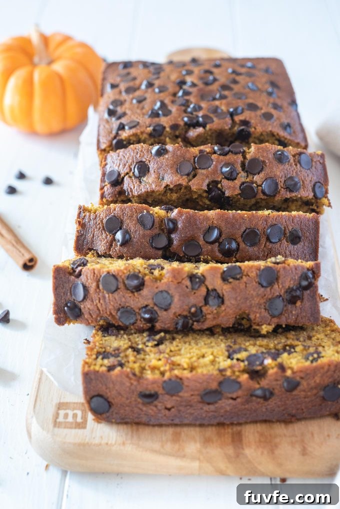 Slices of gluten-free pumpkin bread on a cutting board