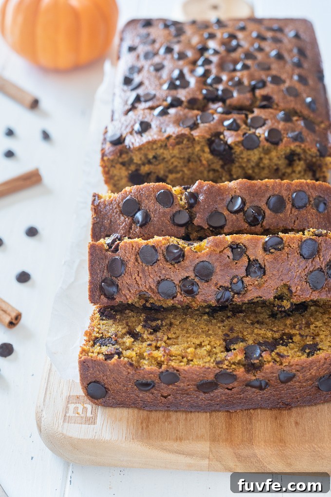 Thick slices of gluten-free pumpkin bread on a cutting board