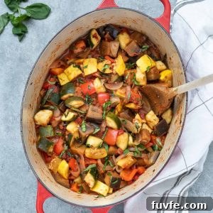 Ratatouille in a Dutch oven with basil on top
