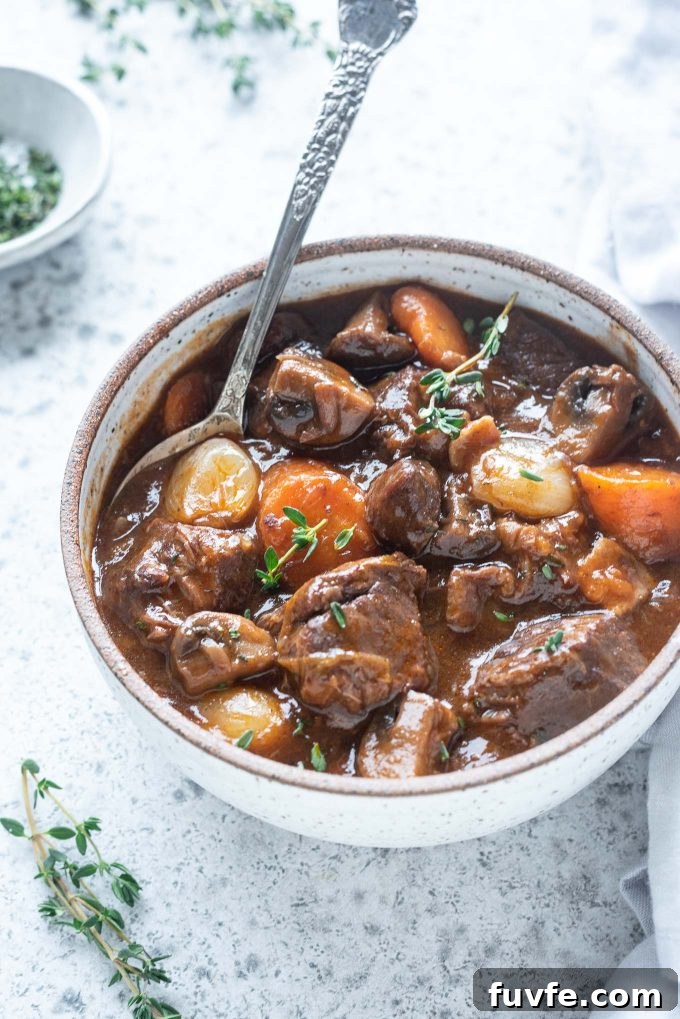 Instant Pot Beef Bourguignon Recipe 2 Bowl of beef bourguignon with spoon digging in