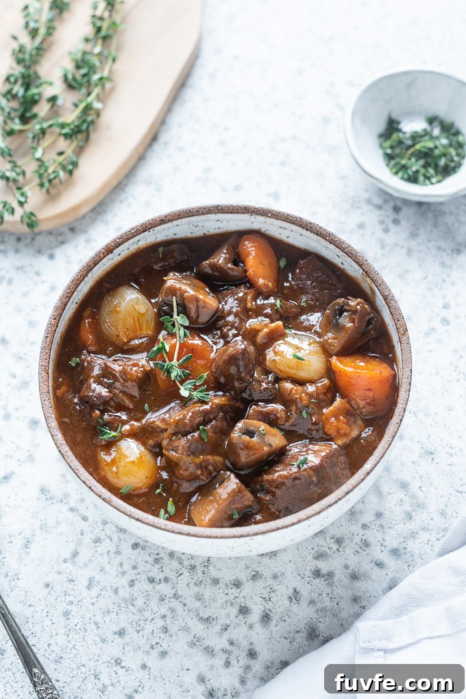 Instant Pot Beef Bourguignon Recipe 7 Bowl of instant pot beef bourguignon with fresh thyme