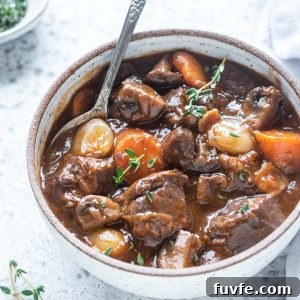 Instant Pot Beef Bourguignon Recipe 8 Bowl of beef bourguignon with spoon digging in