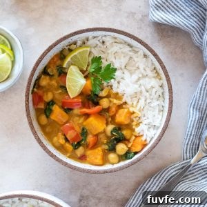 Creamy Vegan Instant Pot Sweet Potato Chickpea Curry 9 Instant pot sweet potato chickpea curry in a bowl with lime and cilantro