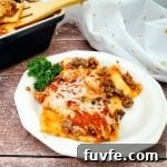 Quick Ravioli Lasagna Recipe for Fast Weeknight Dinners 12 Image of finished lazy ravioli lasagna plated on white dish