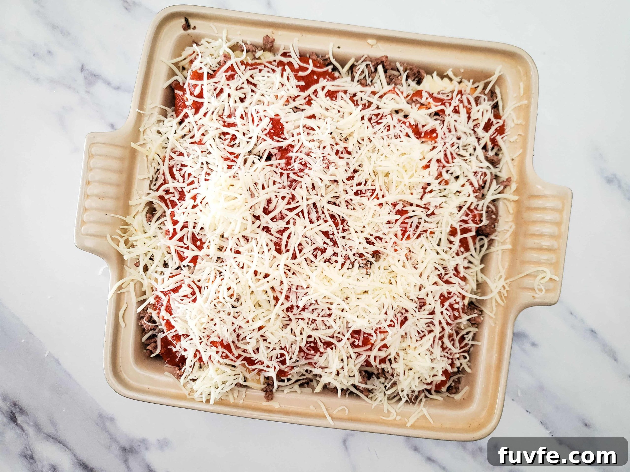 Quick Ravioli Lasagna Recipe for Fast Weeknight Dinners 9 Casserole baking dish with layers of frozen ravioli lasagna