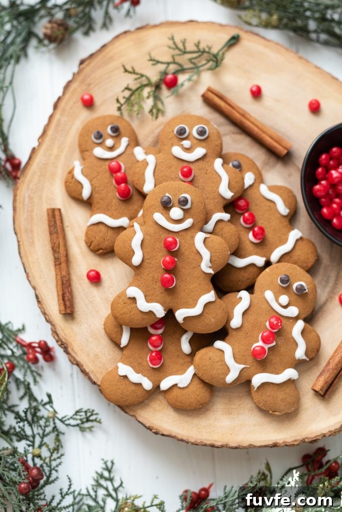 Gingerbread cookies piled on a wooden server