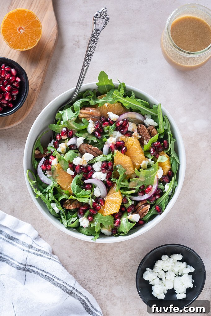 Arugula pomegranate salad with goat cheese and pomegranate dressing