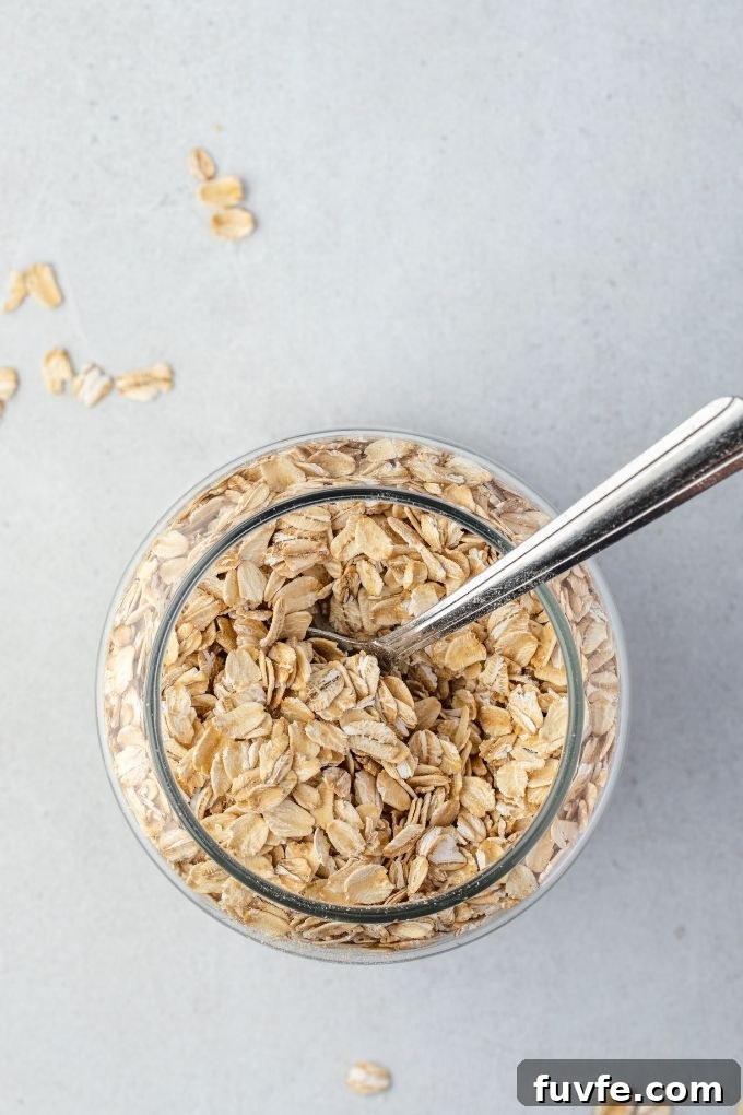 Rolled oats in a jar with a spoon