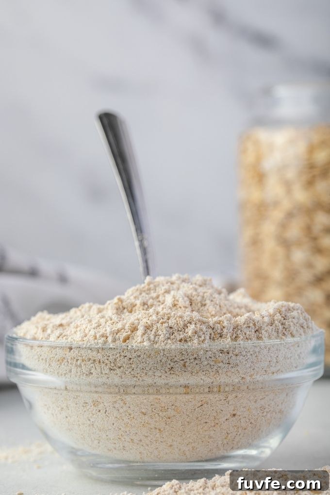 Oat flour in a bowl with a large spoon