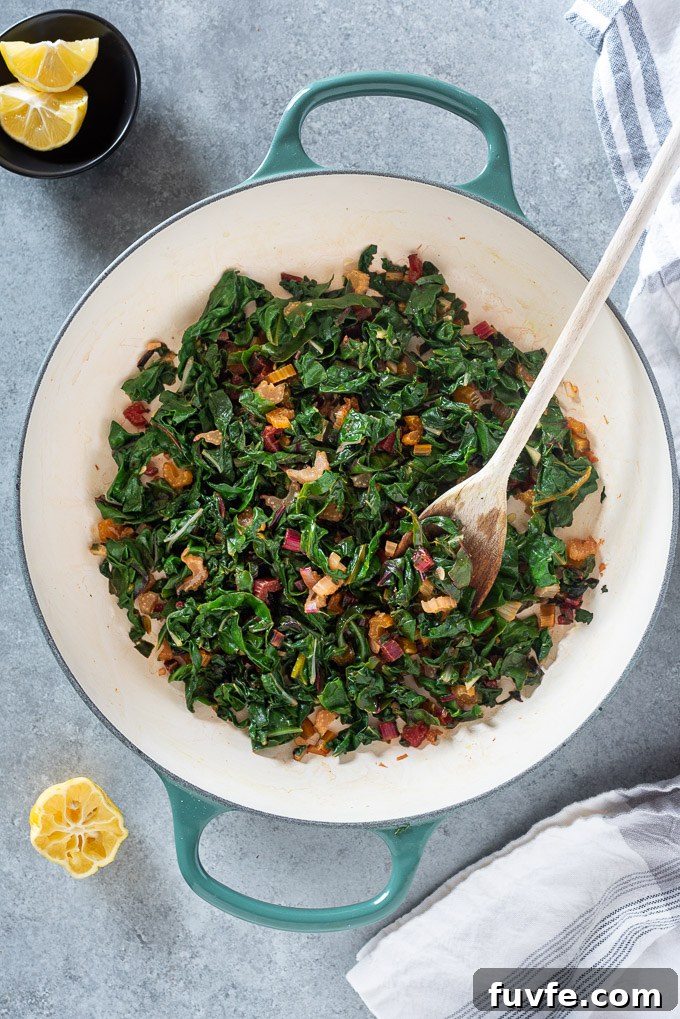 Dutch oven with sautéed rainbow swiss chard