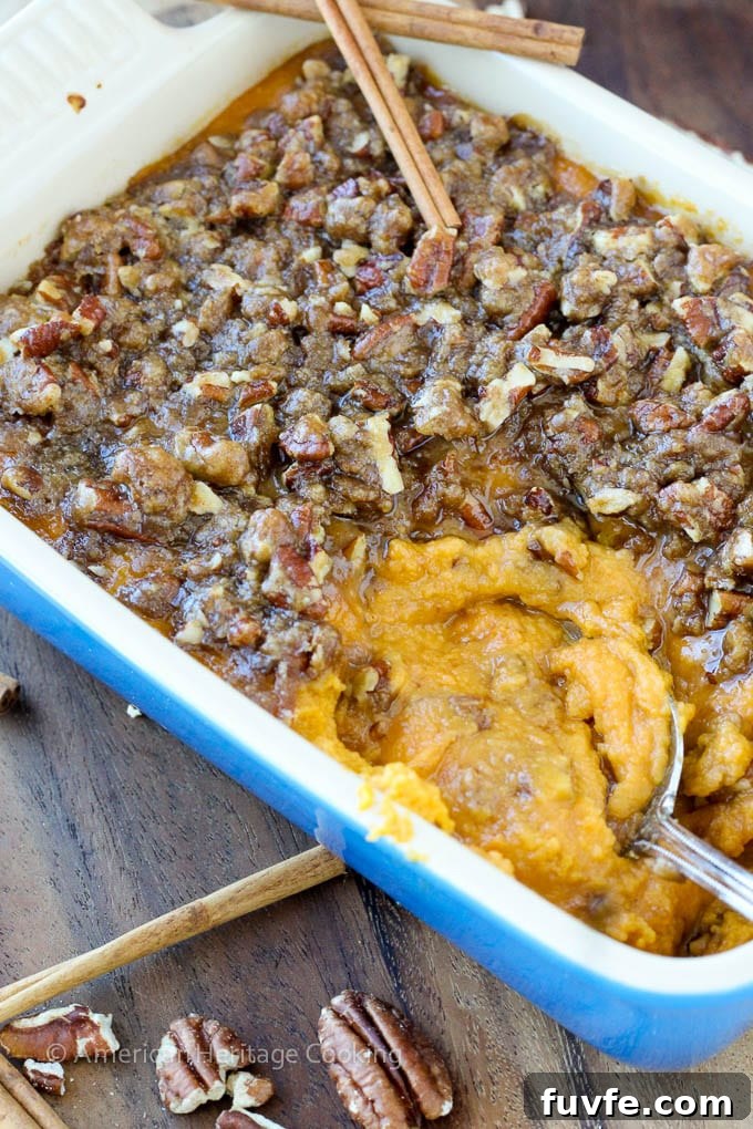 An easy recipe for Sweet Potato Casserole Lightened Up! Still packed with brown sugar, buttery goodness but with half the calories! 