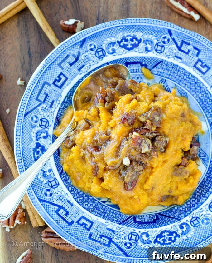 An easy recipe for Sweet Potato Casserole Lightened Up! Still packed with brown sugar, buttery goodness but with half the calories! 