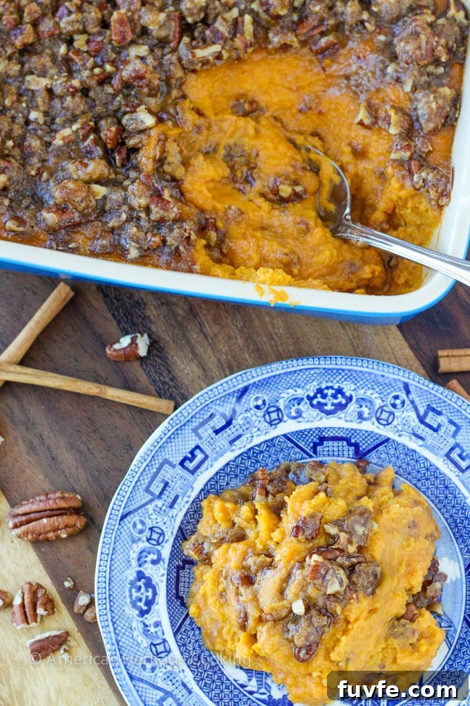 An easy recipe for Sweet Potato Casserole Lightened Up! Still packed with brown sugar, buttery goodness but with half the calories! 