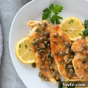 Skillet Chicken Piccata with Lemon Caper Sauce 10 Chicken piccata on a serving plate