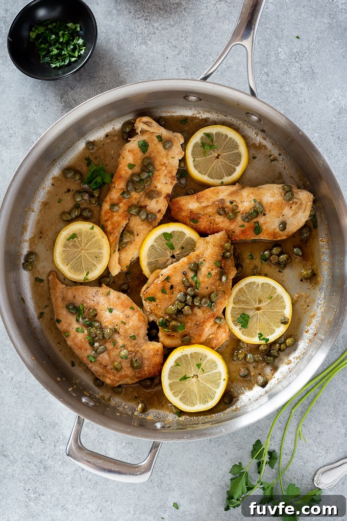 Weeknight Chicken Piccata Recipe with Lemon Caper Sauce 7 Chicken piccata in the pan with lemon