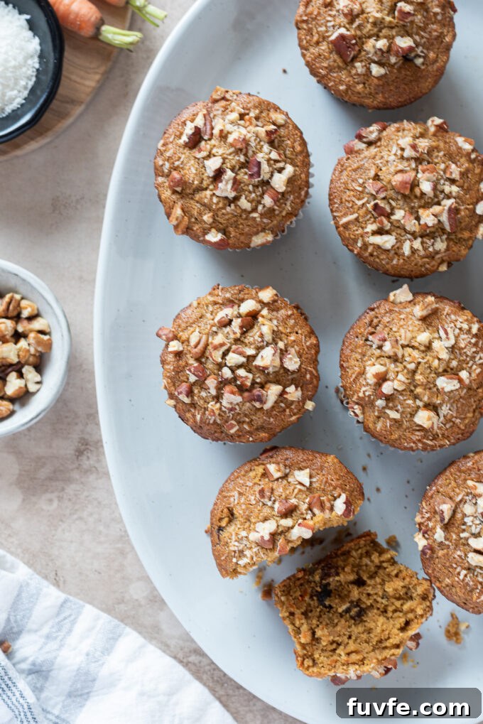 Gluten-free morning glory muffins with pecans on top.