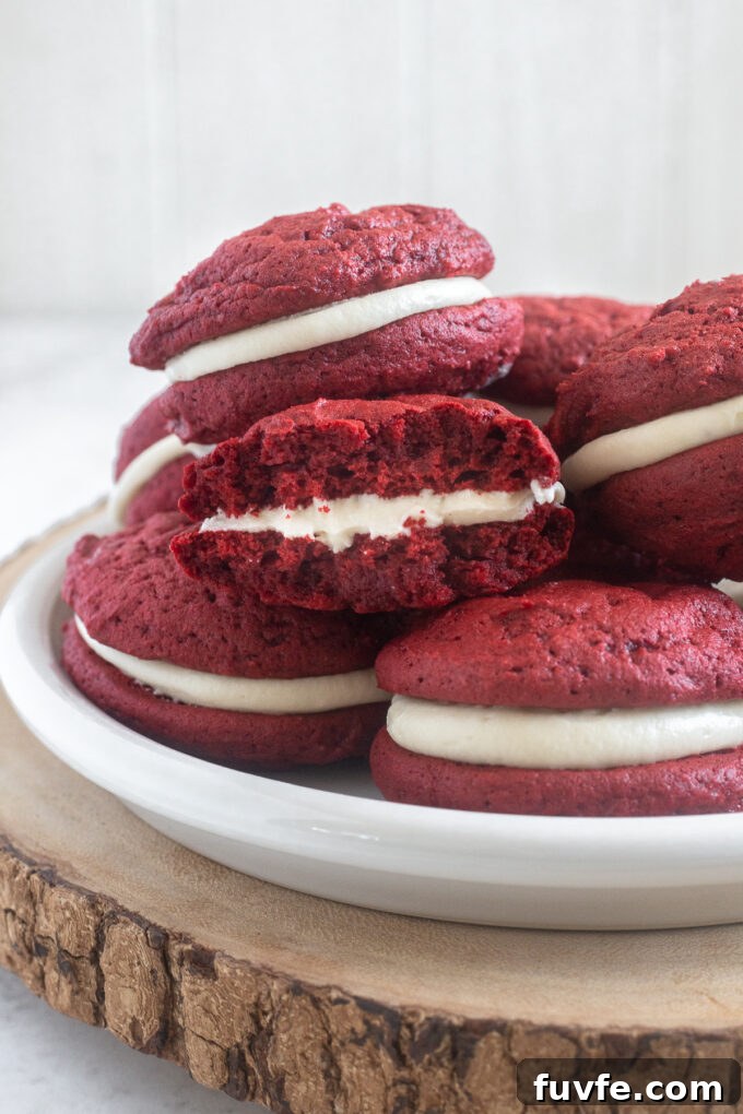 Red velvet whoopie pie cut in half.