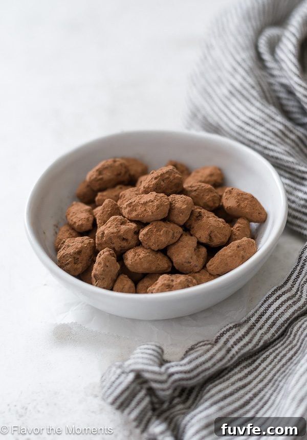 Almond Dragees: Sugar-Coated Jordan Almonds Recipe 2 Almond dragees in white bowl.