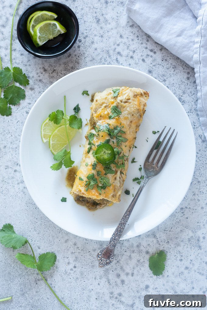 Ground turkey enchilada on a plate with a fork
