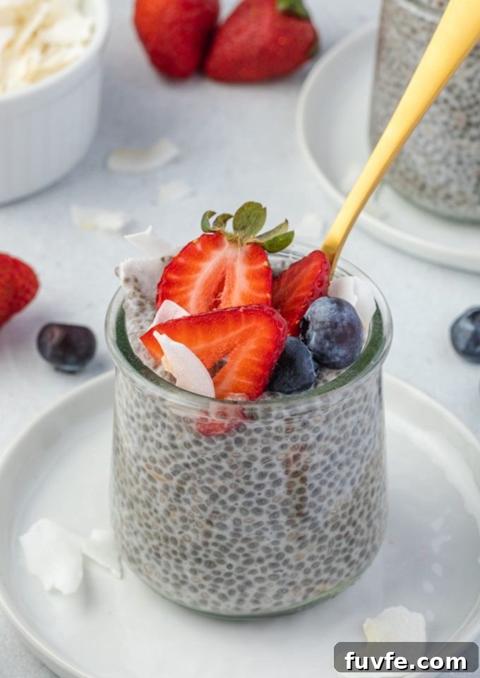 Chia seed pudding in a jar with a spoon digging in