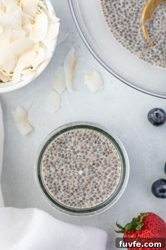 Chia seed pudding in a jar surrounded by toppings
