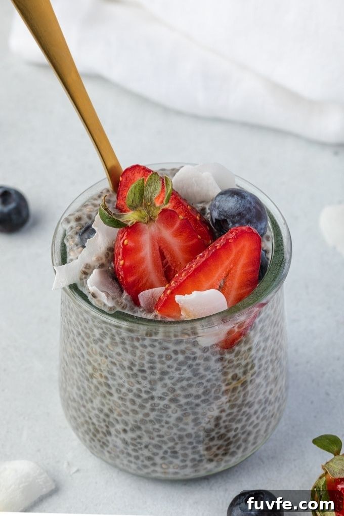 Chia seed pudding in a jar topped with berries and coconut