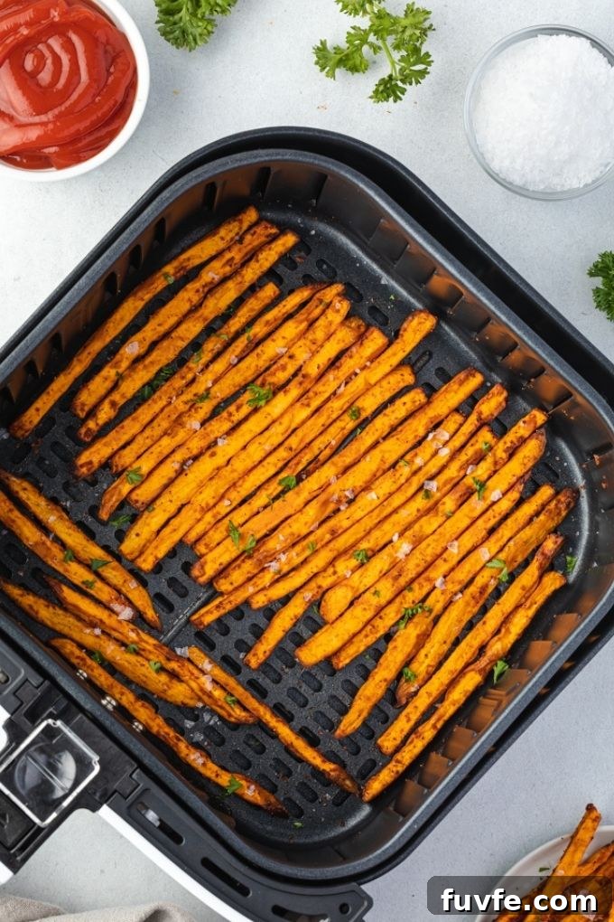 Crispy Air Fryer Sweet Potato Fries 3 Sweet potato fries in air fryer.