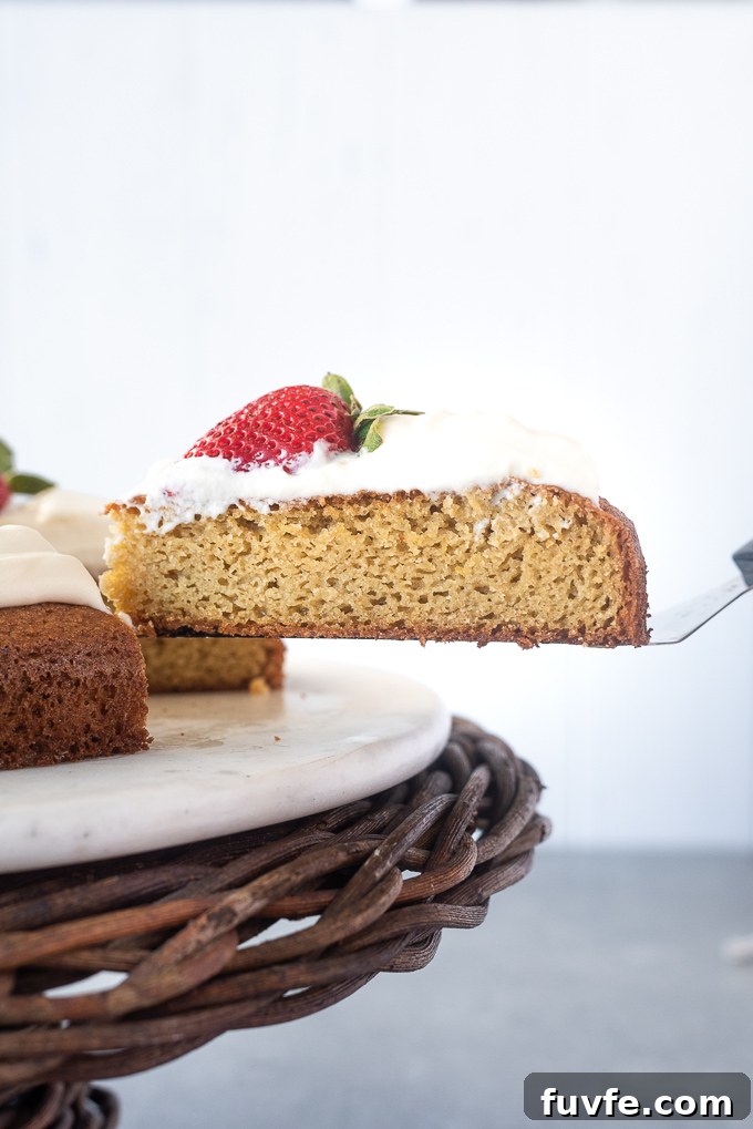 Gluten-Free Almond Flour Cake Recipe 7 Cake server lifting a slice of almond flour lemon cake