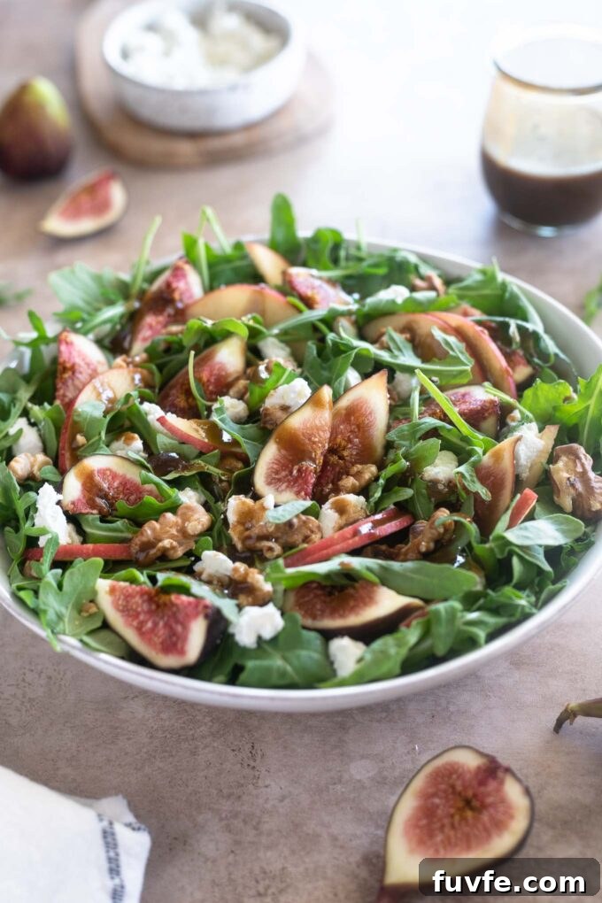 Fig salad in a white bowl with dressing