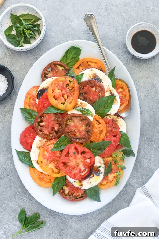 Classic Caprese Salad with Fresh Mozzarella and Balsamic Glaze 8 Caprese salad with balsamic vinegar drizzled over the top