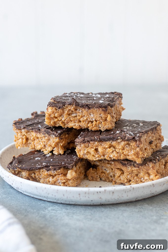 No-Bake Peanut Butter Rice Krispie Treats Recipe 3 Healthy peanut butter rice krispie treats piled on a plate