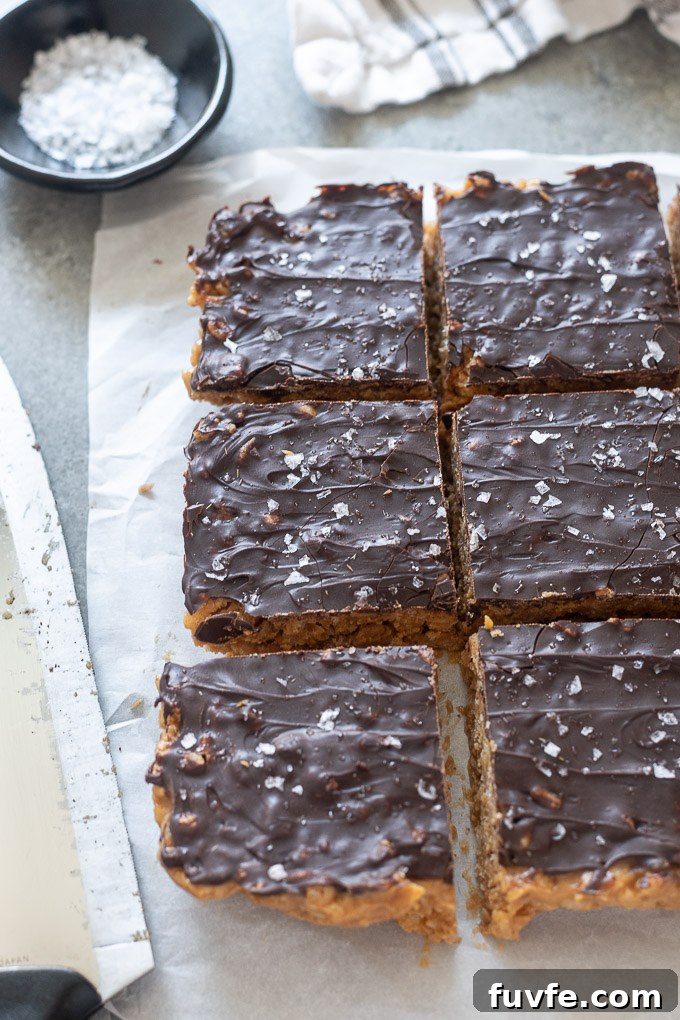 Peanut butter rice crispy bars on parchment paper